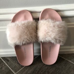 Pink, fluffy Steve Madden slides.